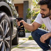 Spraying myTVS Tyre Dresser Cleaner on a car tyre