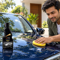 Applying myTVS Carnauba Wax Liquid to a car bonnet with a foam applicator