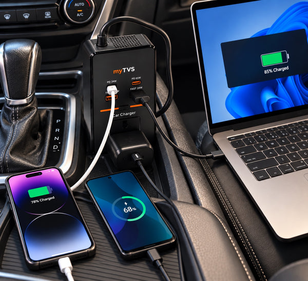 myTVS car laptop charger charging a laptop and two phones on the car console