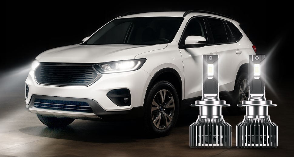 myTVS LED headlight bulbs lighting up a white SUV at night